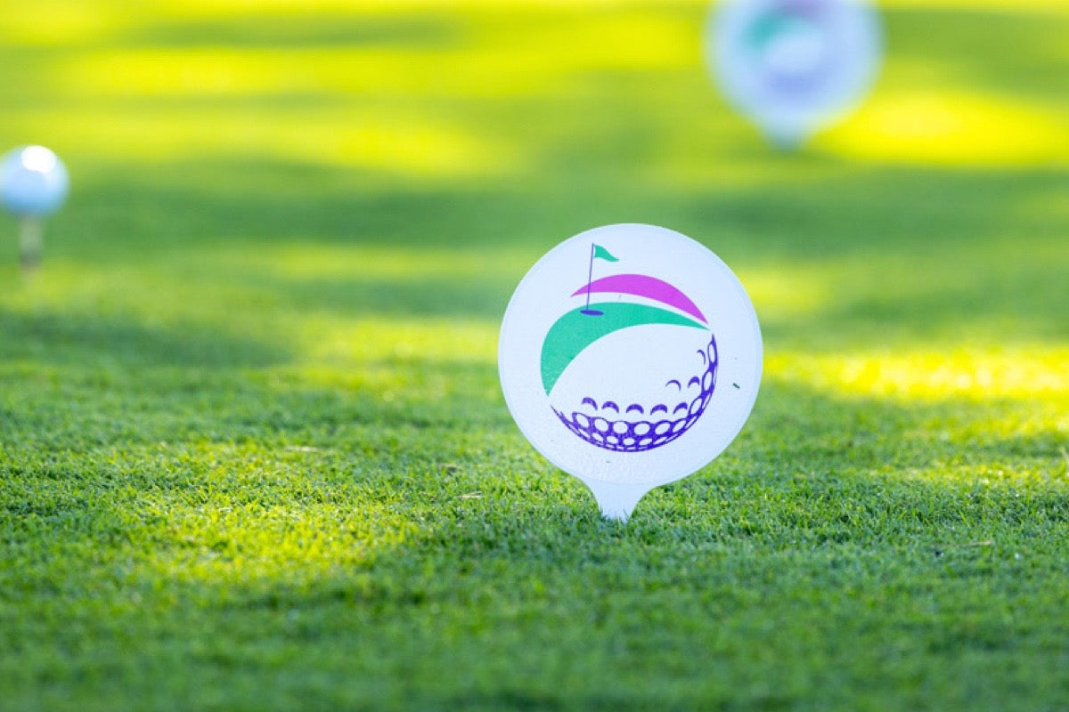 Hit Fore Hope charity golf tournament tee marker on the first tee before the fundraising event supporting families facing cancer.