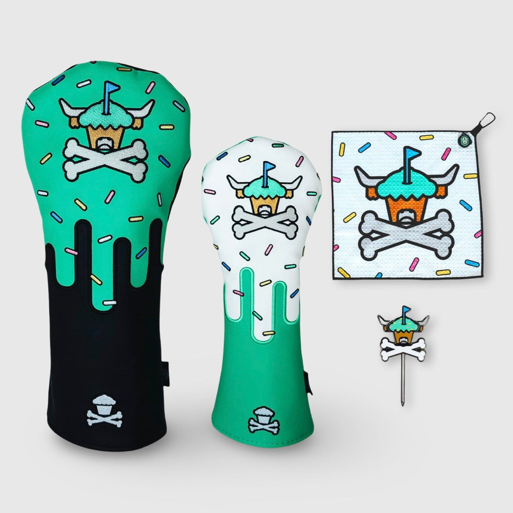 Johnny Cupcakes x Caddy Collective Culture Frosted Fairways golf collection featuring Looper cupcake driver and fairway headcovers, golf towel, and divot tool on light gray background.