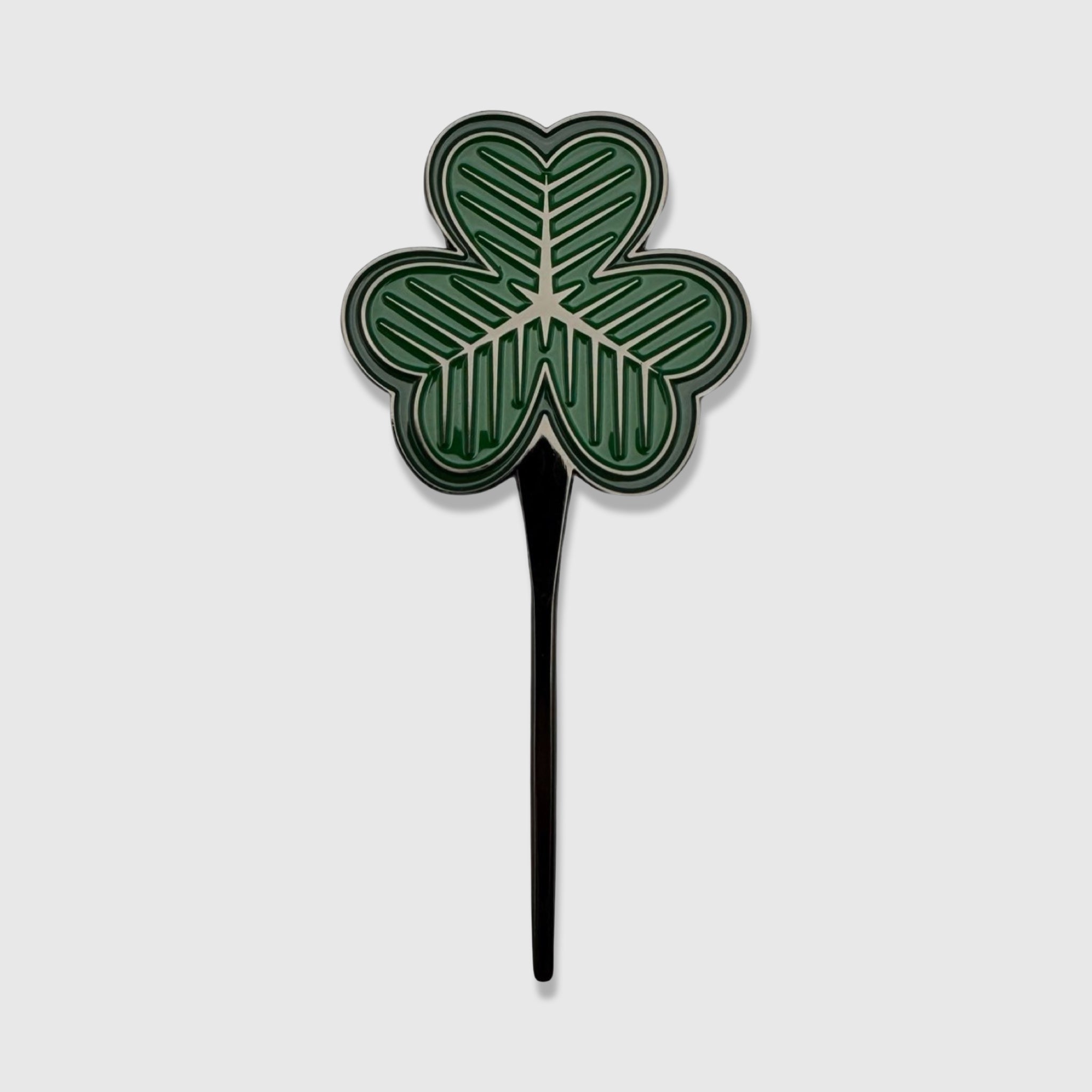 Premium green shamrock divot tool with black stem by Caddy Collective Culture, inspired by St. Patrick’s golf tradition