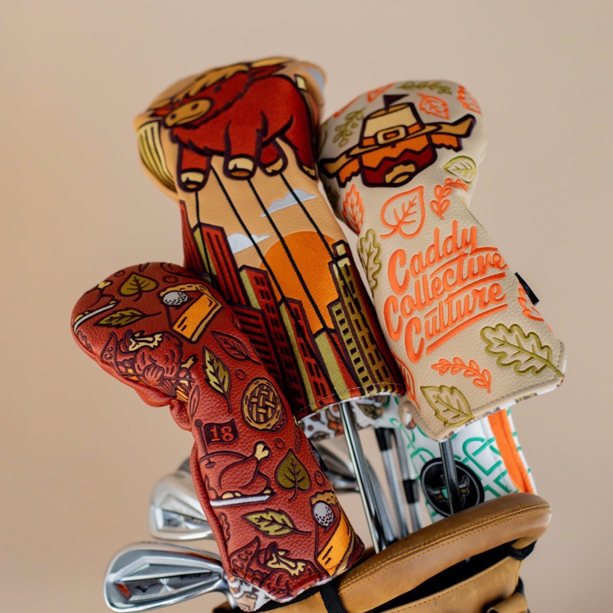 Autumn Feast hybrid headcover in a premium carry bag alongside the Harvest Parade driver and Pilgrim Looper fairway designs.