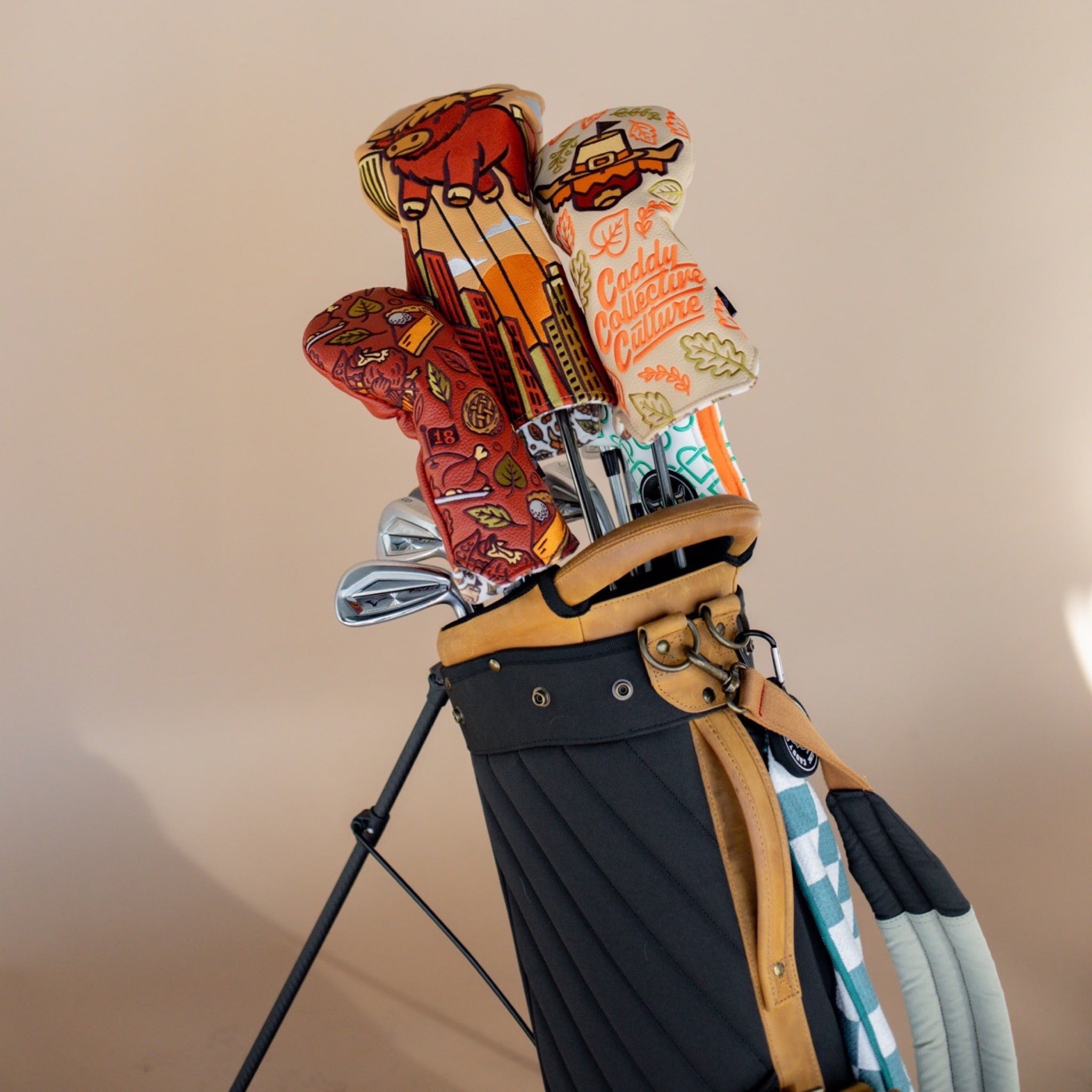 Harvest Parade driver headcover in a premium carry bag alongside coordinating Thanksgiving designs.