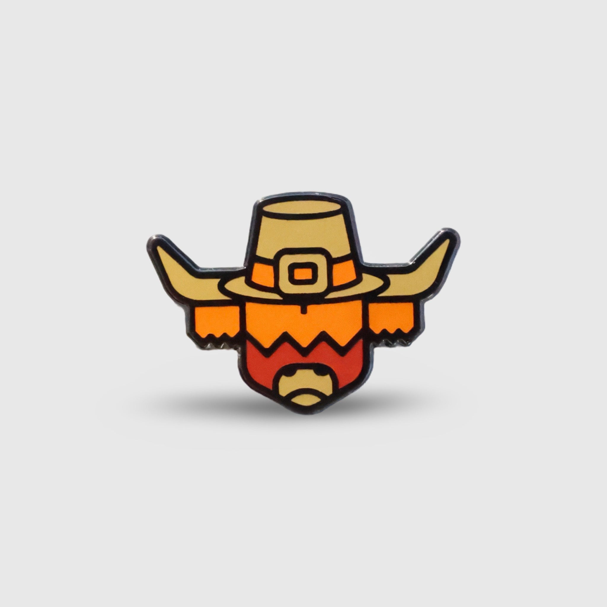 Pilgrim Looper ball marker by Caddy Collective Culture featuring a stylized pilgrim Looper character in warm Thanksgiving colors.