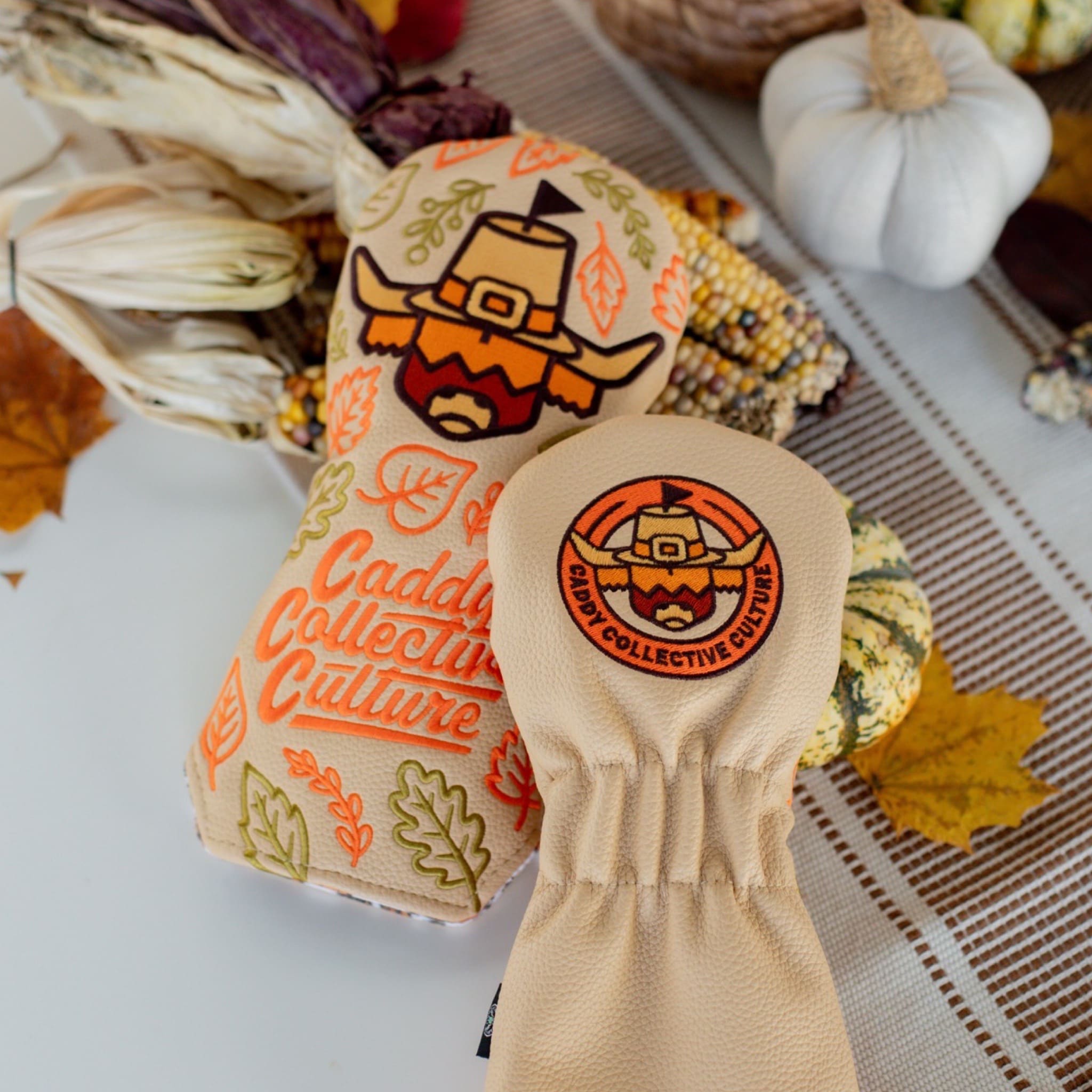 Front and back view of the Pilgrim Looper fairway headcover showing embroidered logo and Thanksgiving leaf pattern.