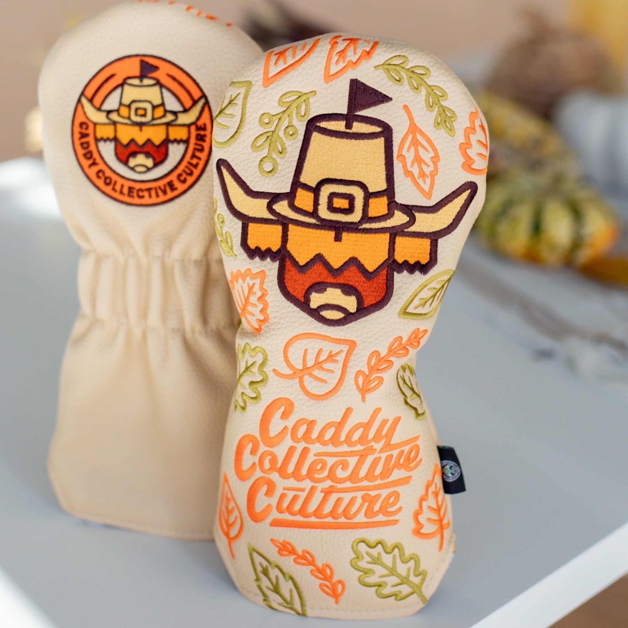 Front view of the Pilgrim Looper fairway headcover showing the pilgrim Looper artwork and embroidered Caddy Collective Culture lettering.