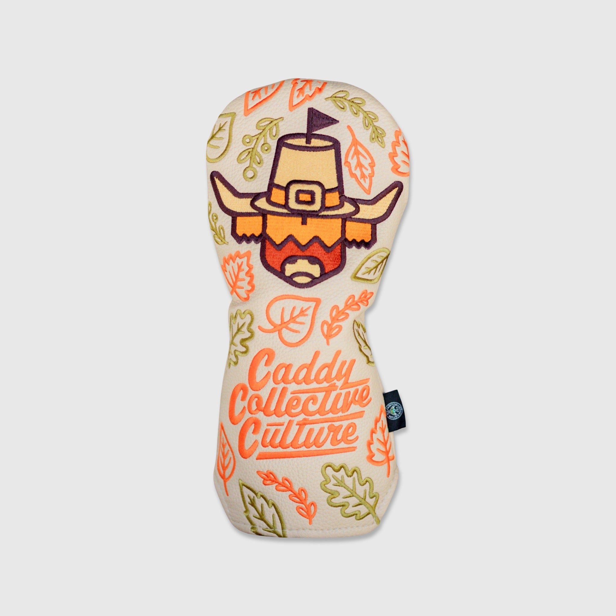 Pilgrim Looper fairway headcover by Caddy Collective Culture with a festive pilgrim Looper design and fall leaf pattern on a cream background.
