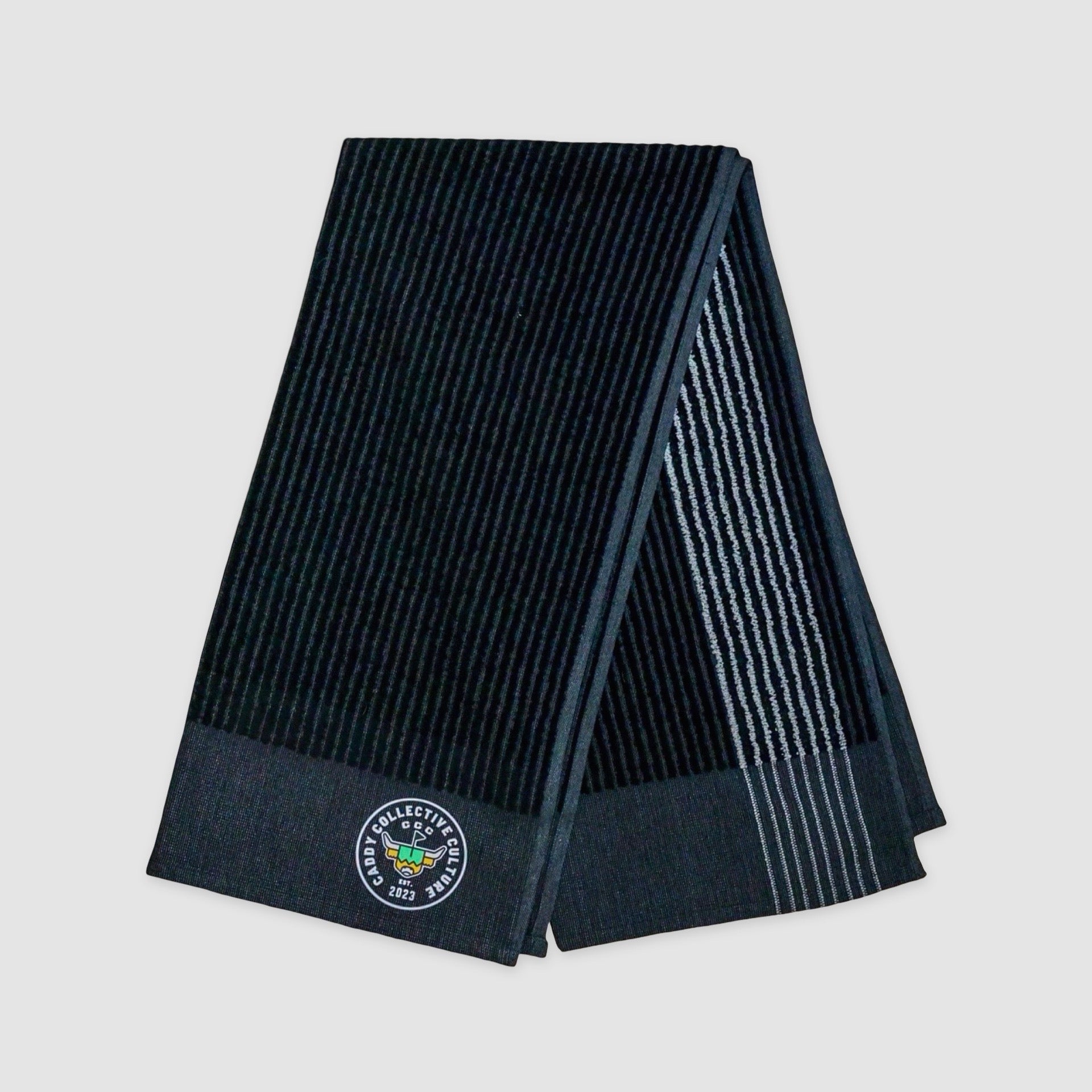 Folded black CCC Tour Caddy Towel showing thickness and edge detail