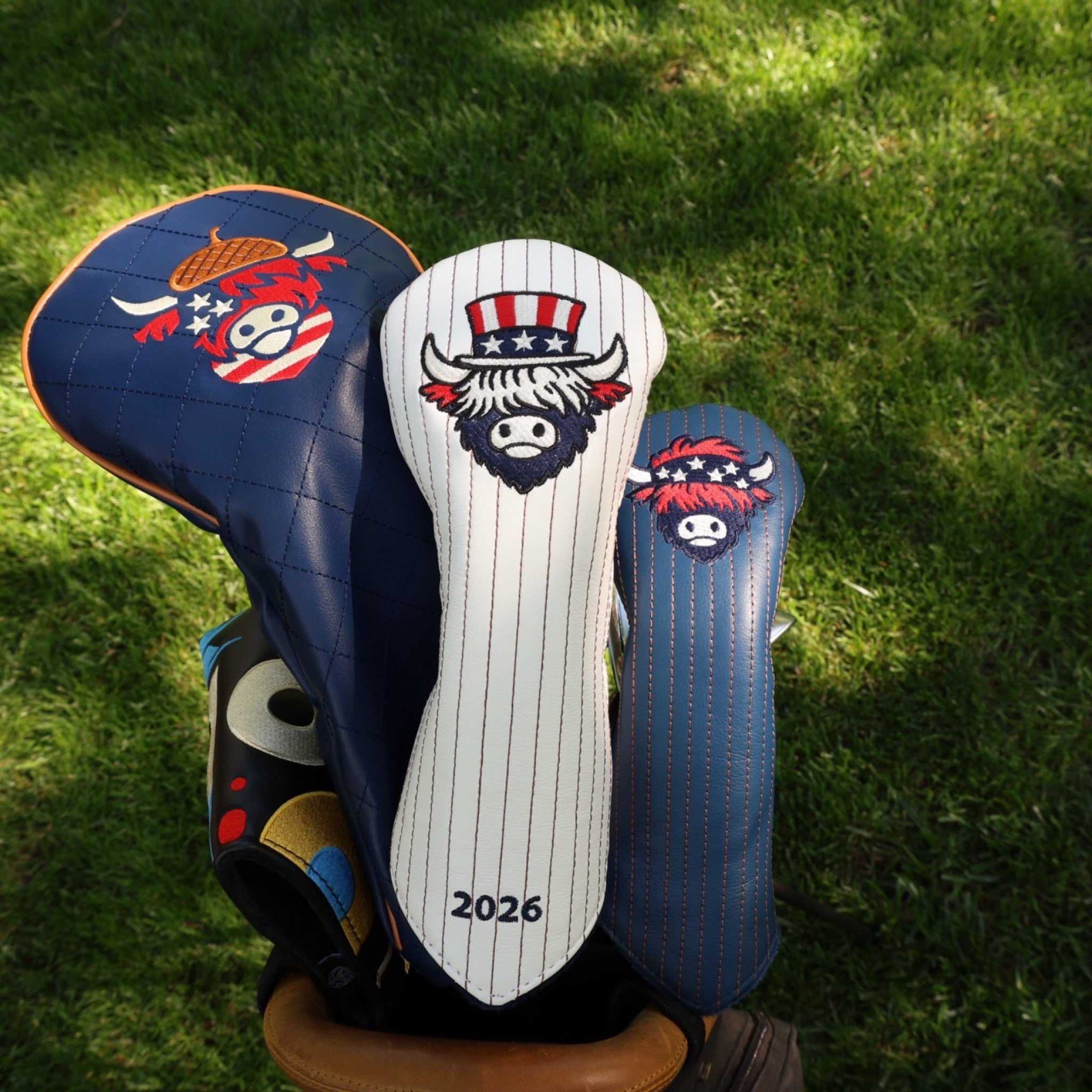 The Founders Collection golf headcovers displayed together including fairway wood and hybrid headcovers