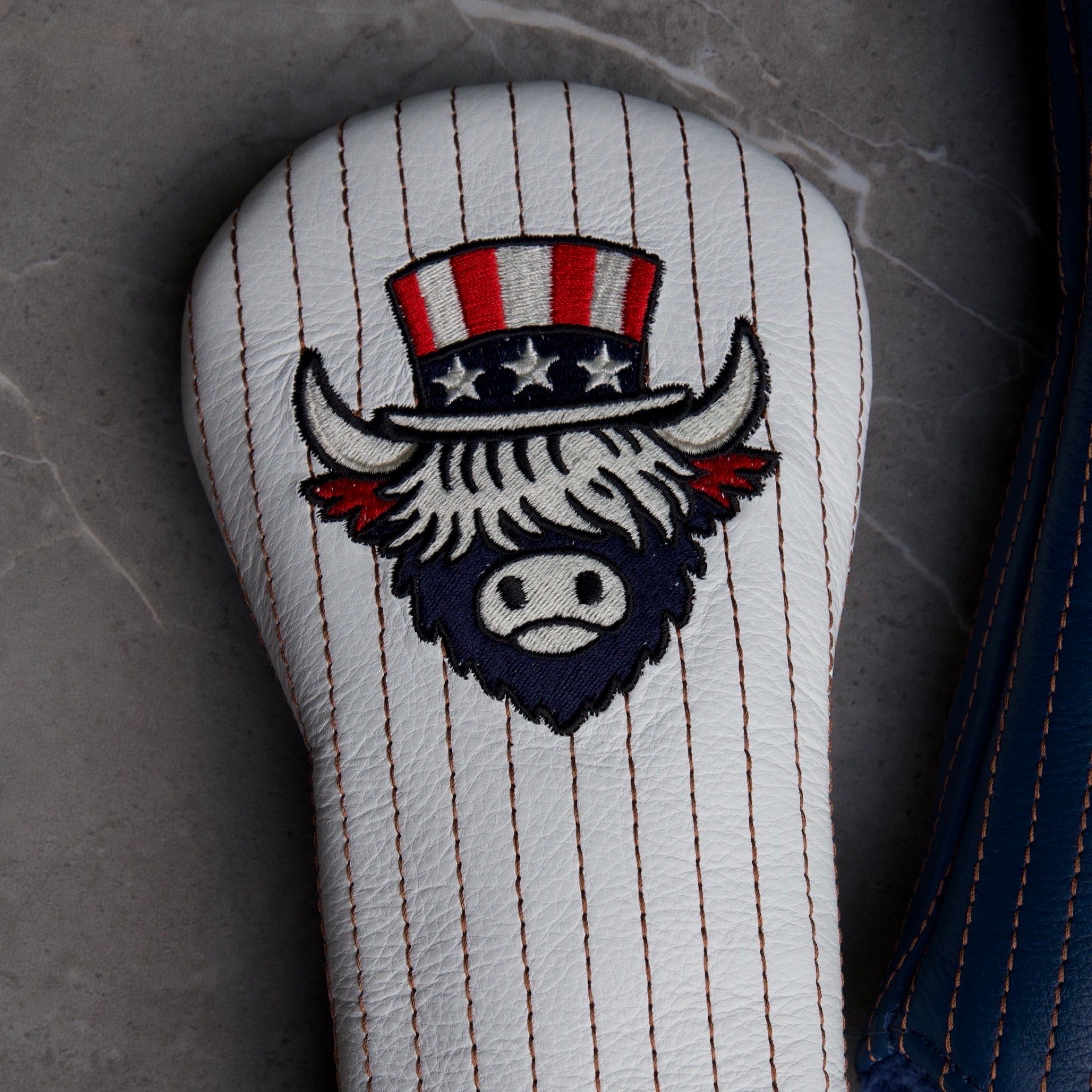 Angled front view of The Founder Fairway Cover featuring Americana-inspired Looper embroidery