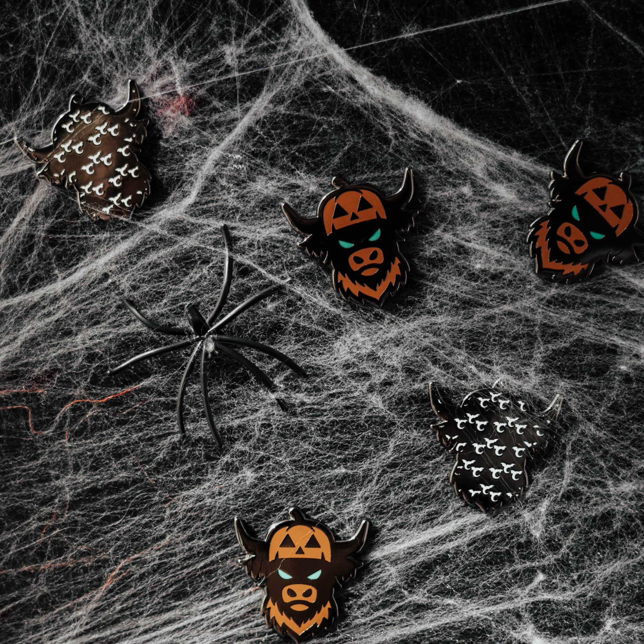 Looper After Dark pumpkin Looper ball markers arranged on dark web textured surface