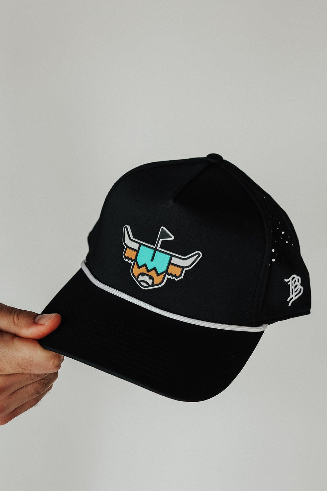 Close-up of the Looper Rope Hat logo, rope detail, and side embroidery.