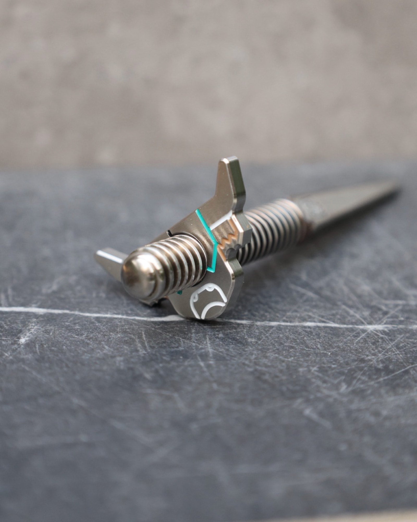 Premium close-up of the Looper Threaded Divot Tool crafted from 303 and 316 stainless steel with interchangeable threaded ball marker.