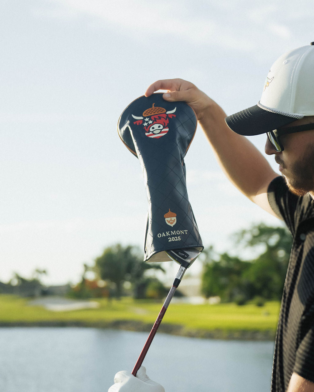 Side angle of close-up of detailed stitching on Oakmont driver headcover showing patriotic color accents