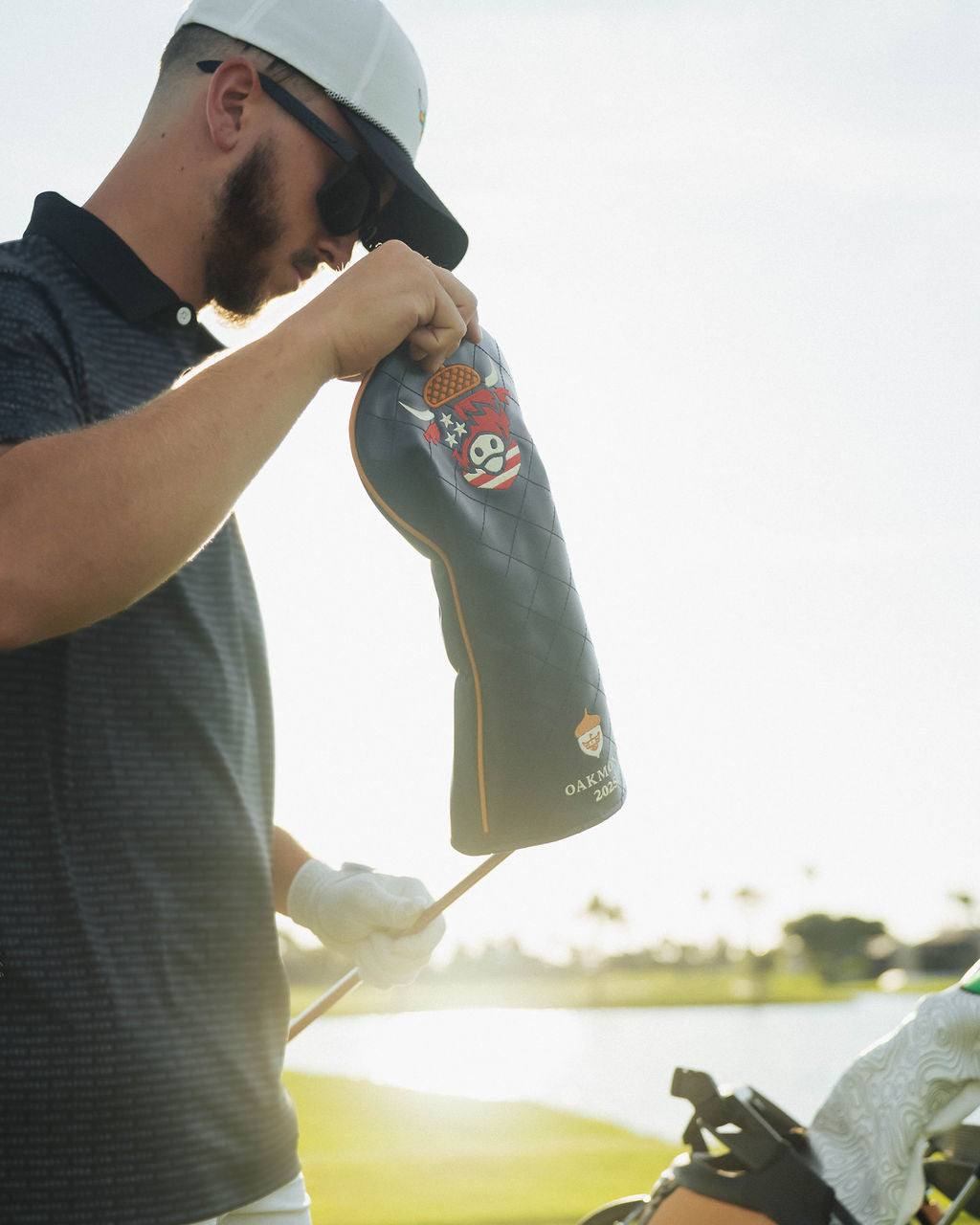 Side angle of close-up of detailed stitching on Oakmont driver headcover showing patriotic color accents