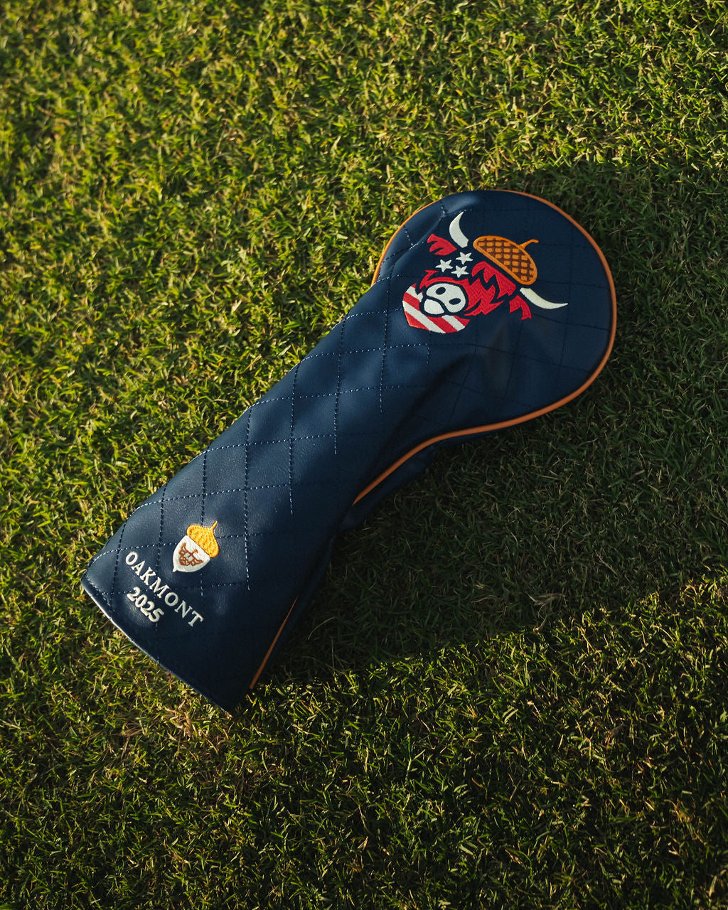 Close-up of detailed stitching on Oakmont driver headcover showing patriotic color accents