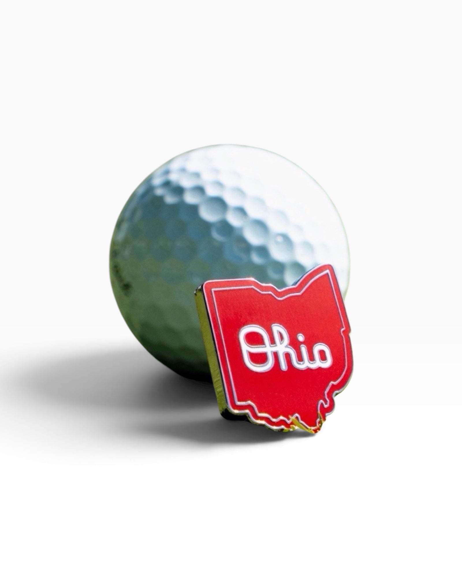 Officially licensed Ohio State Script Ohio golf ball marker in scarlet and white