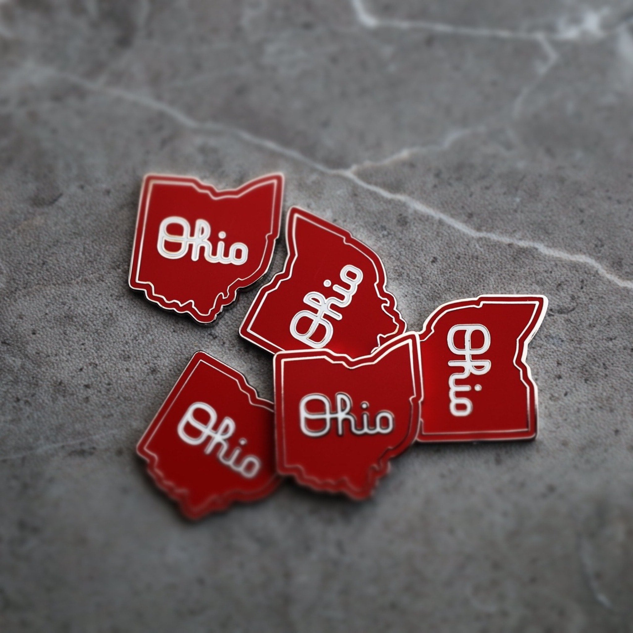 Single Script Ohio golf ball marker shaped like the state of Ohio in red enamel