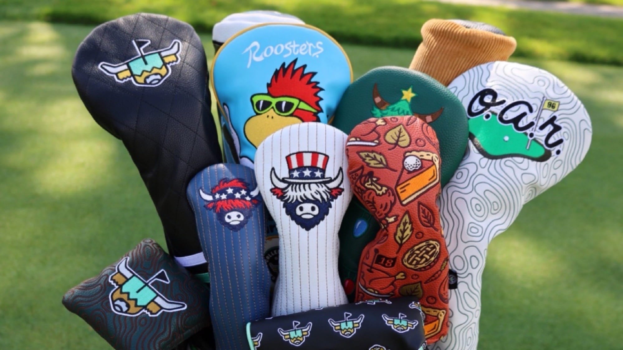 Collection of custom embroidered golf headcovers by Caddy Collective featuring leather, patterned, and collaborative designs including Americana, topographic, holiday, and custom branded golf headcovers.