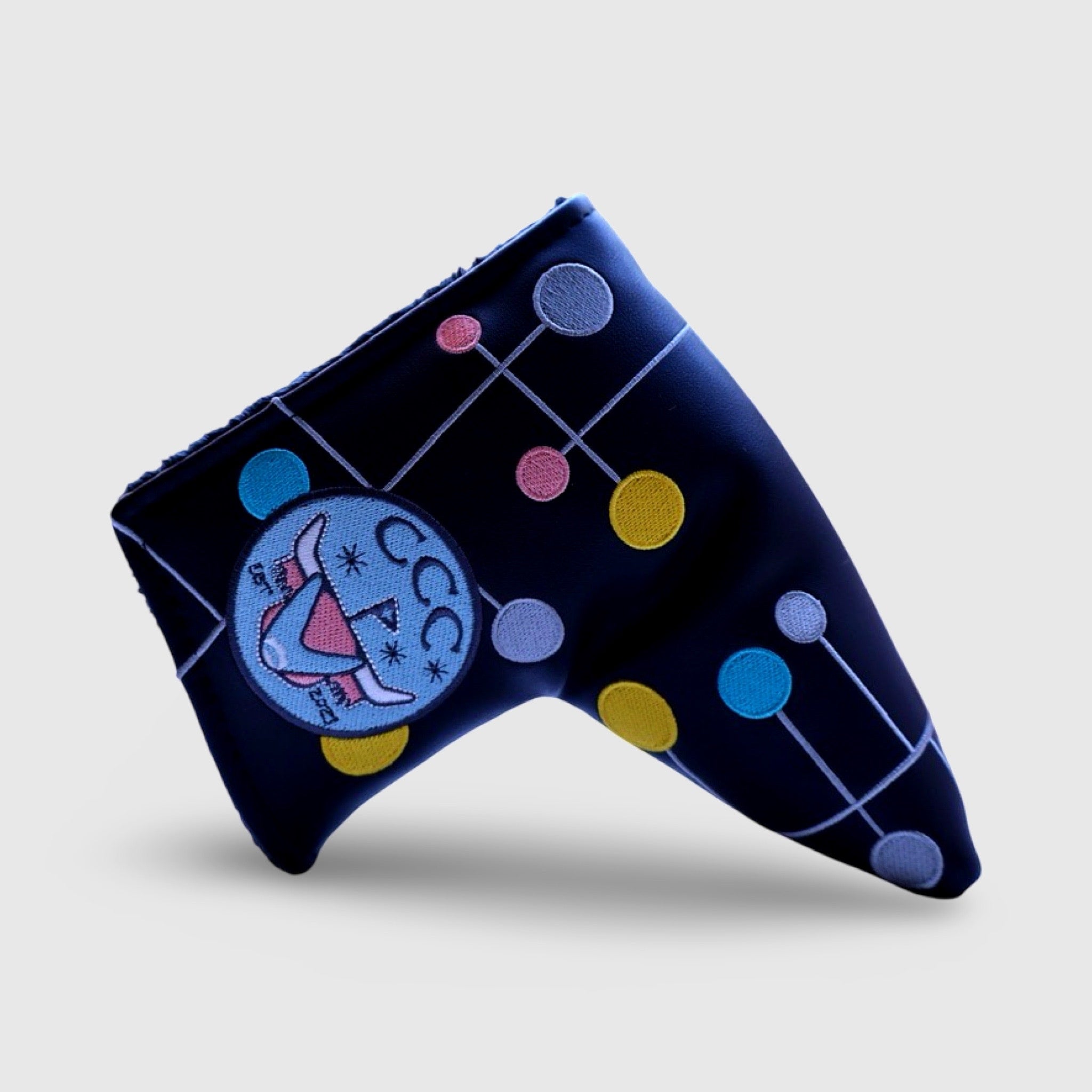 Close-up of Atomic Era headcover showing CCC Looper logo and colorful atomic motif.