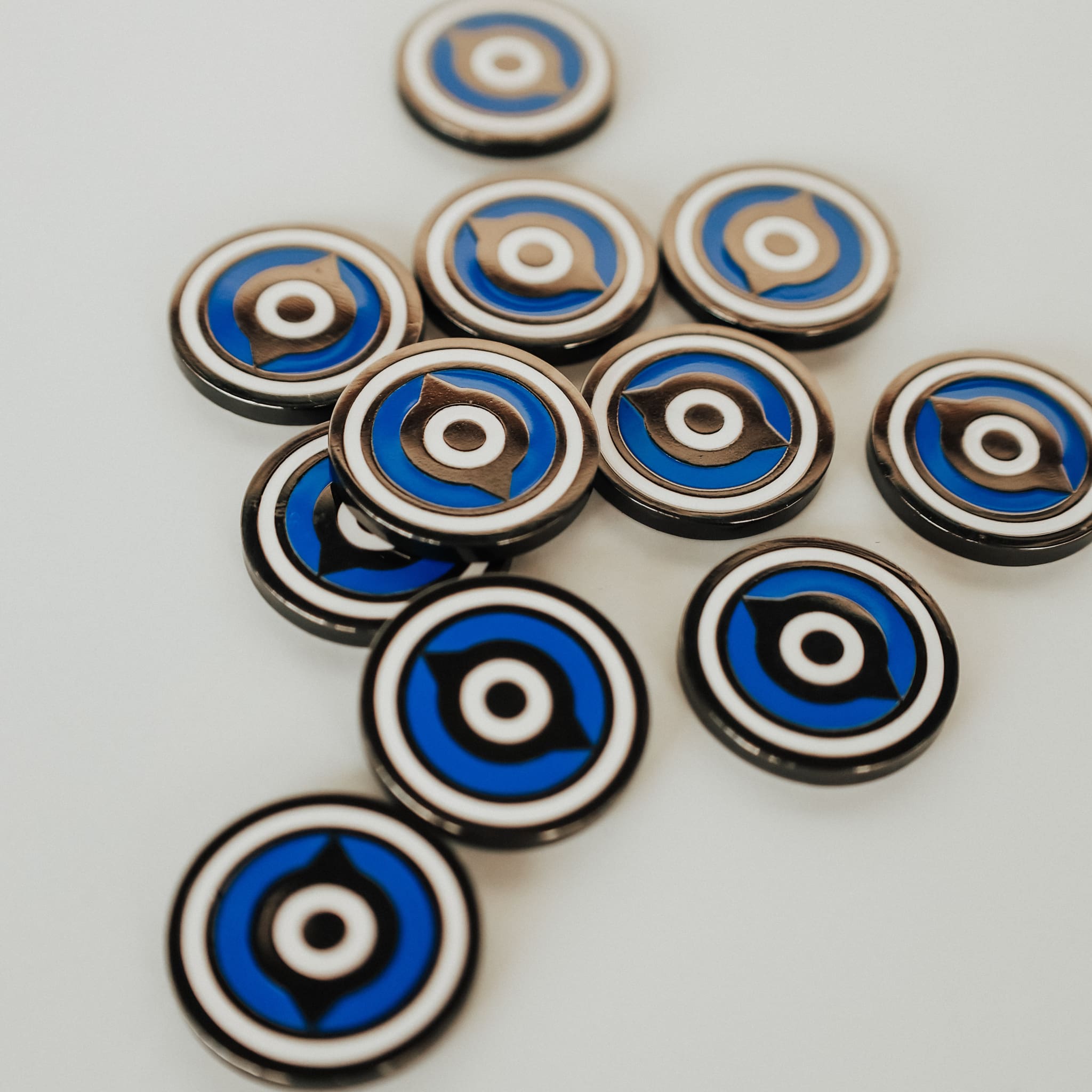 Close-up view of Fore Eye ball markers showing metal edges and polished enamel surface.