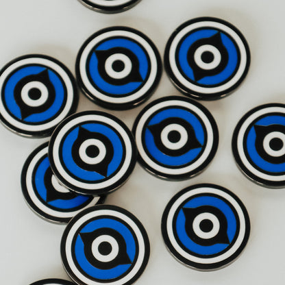 Overhead view of multiple Fore Eye ball markers showing glossy enamel finish and circular design repetition.