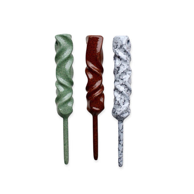 Dual-Twist single prong divot tools shown in three material finishes with twisted sculptural design by Caddy Collective Culture