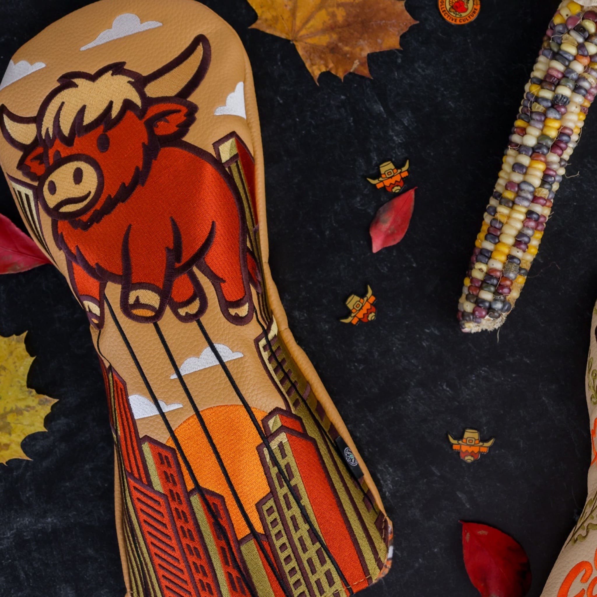 Detail shot of the Harvest Parade driver headcover highlighting the stitching, texture, and Looper balloon artwork.