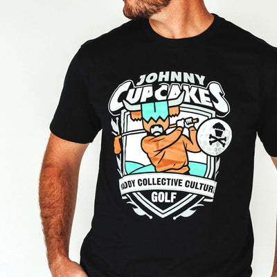 Close-up of Johnny Cupcakes x CCC golf T-shirt graphic design on chest golf shirt
