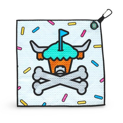 Johnny Cupcakes golf towel shown on white background at an angle