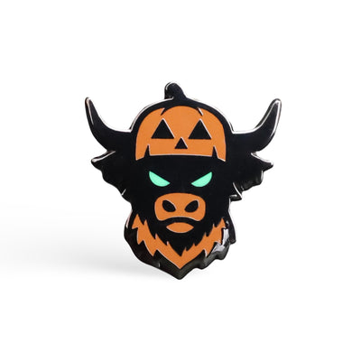 Looper After Dark ball marker with black metal finish, jack-o’-lantern Looper design, and glowing green eyes