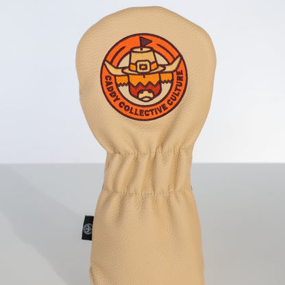 Back view of the Pilgrim Looper fairway headcover featuring the embroidered pilgrim Looper emblem on cream leather.