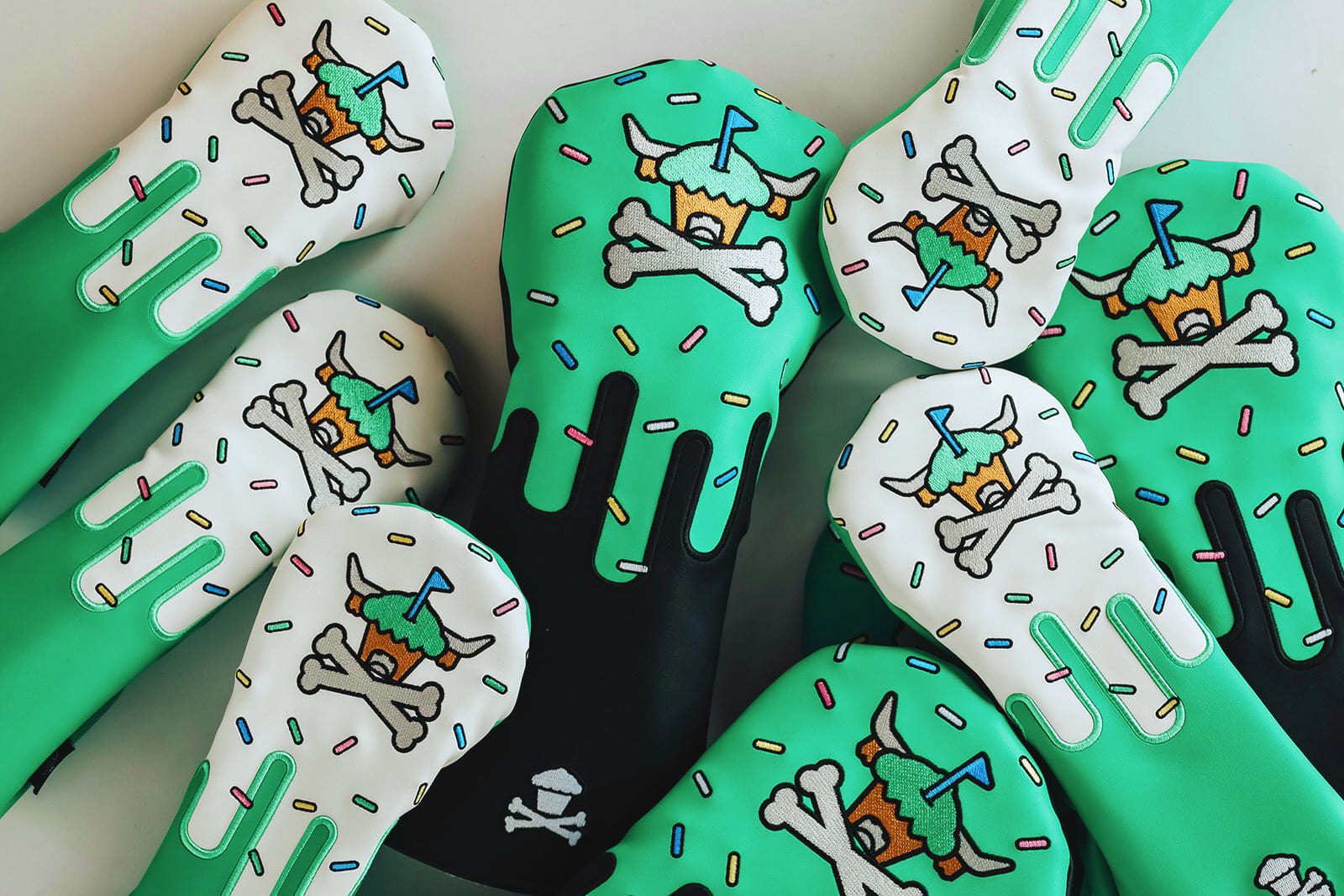 Signature Frost driver headcover displayed with other CCC x Johnny Cupcakes headcovers