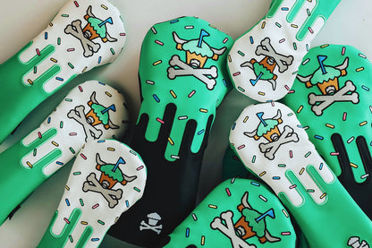 Signature Frost driver headcover displayed with other CCC x Johnny Cupcakes headcovers