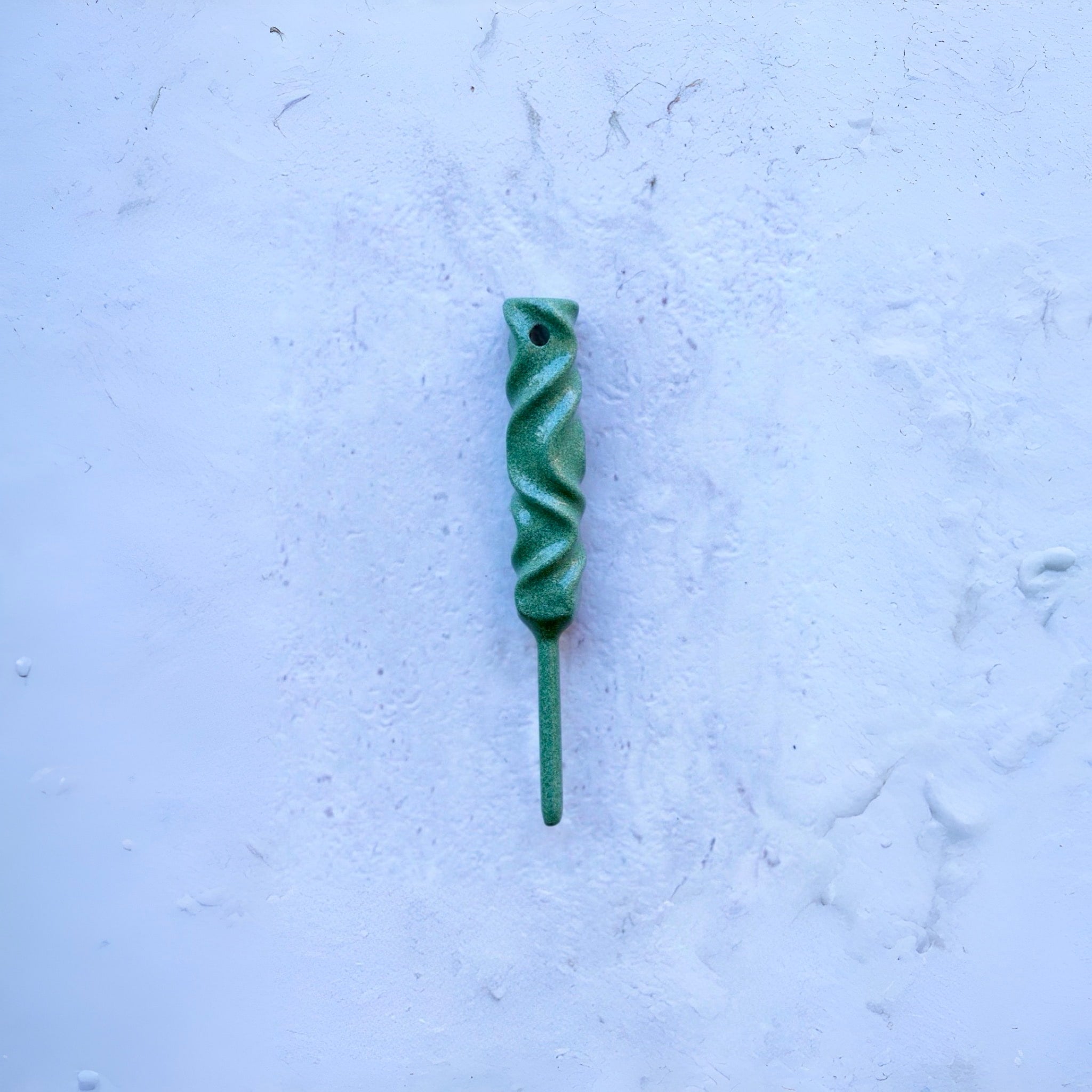 Dual-Twist divot tool in Ithaca bronze finish from the Twisted Metal collection, shown straight on against a textured white surface.