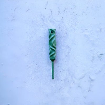 Dual-Twist divot tool in Ithaca bronze finish from the Twisted Metal collection, shown straight on against a textured white surface.