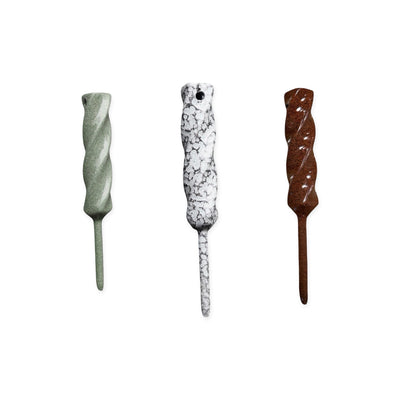 Twisted Metal single prong divot tools shown in multiple metal finishes with sculpted twisted profile by Caddy Collective Culture