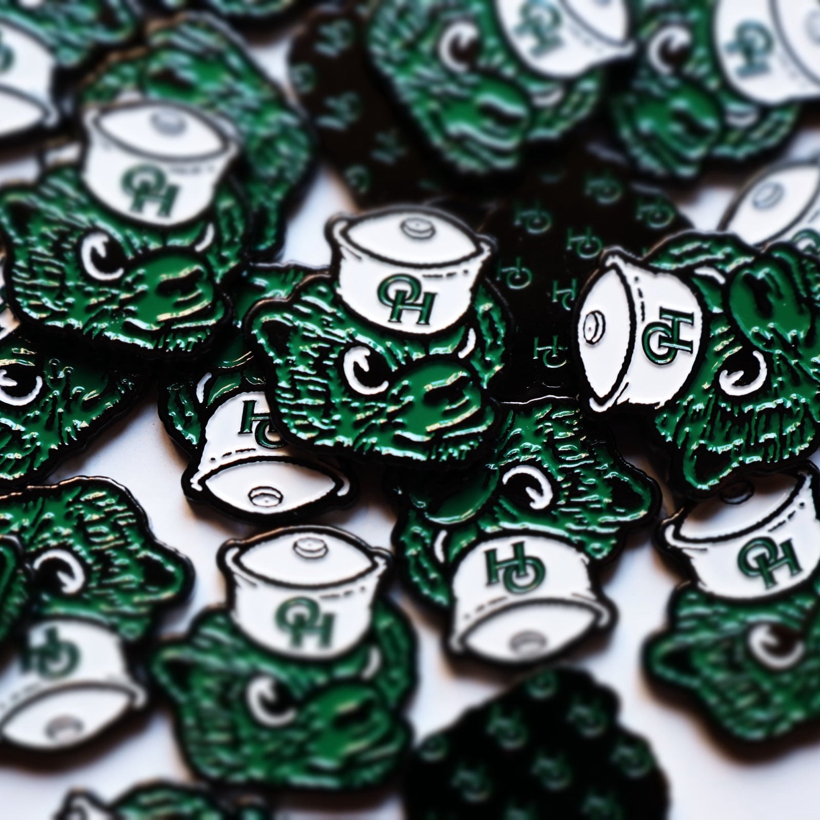 Ottawa Hills Golf Team custom green bear golf ball marker collaboration.
