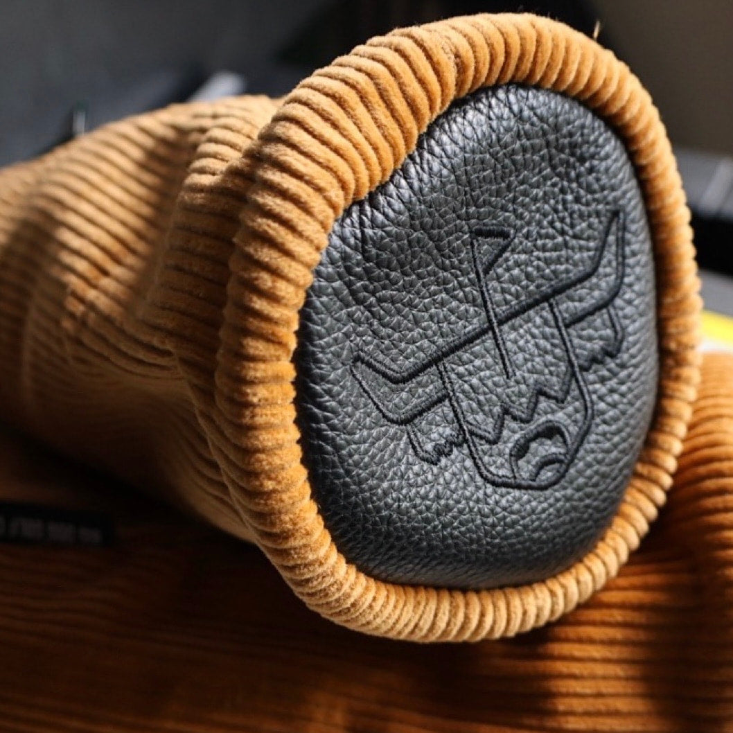 Close-up detail of the Corduroy Barrel Fairway Wood Headcover showcasing premium mustard corduroy texture and charcoal pebbled leather.