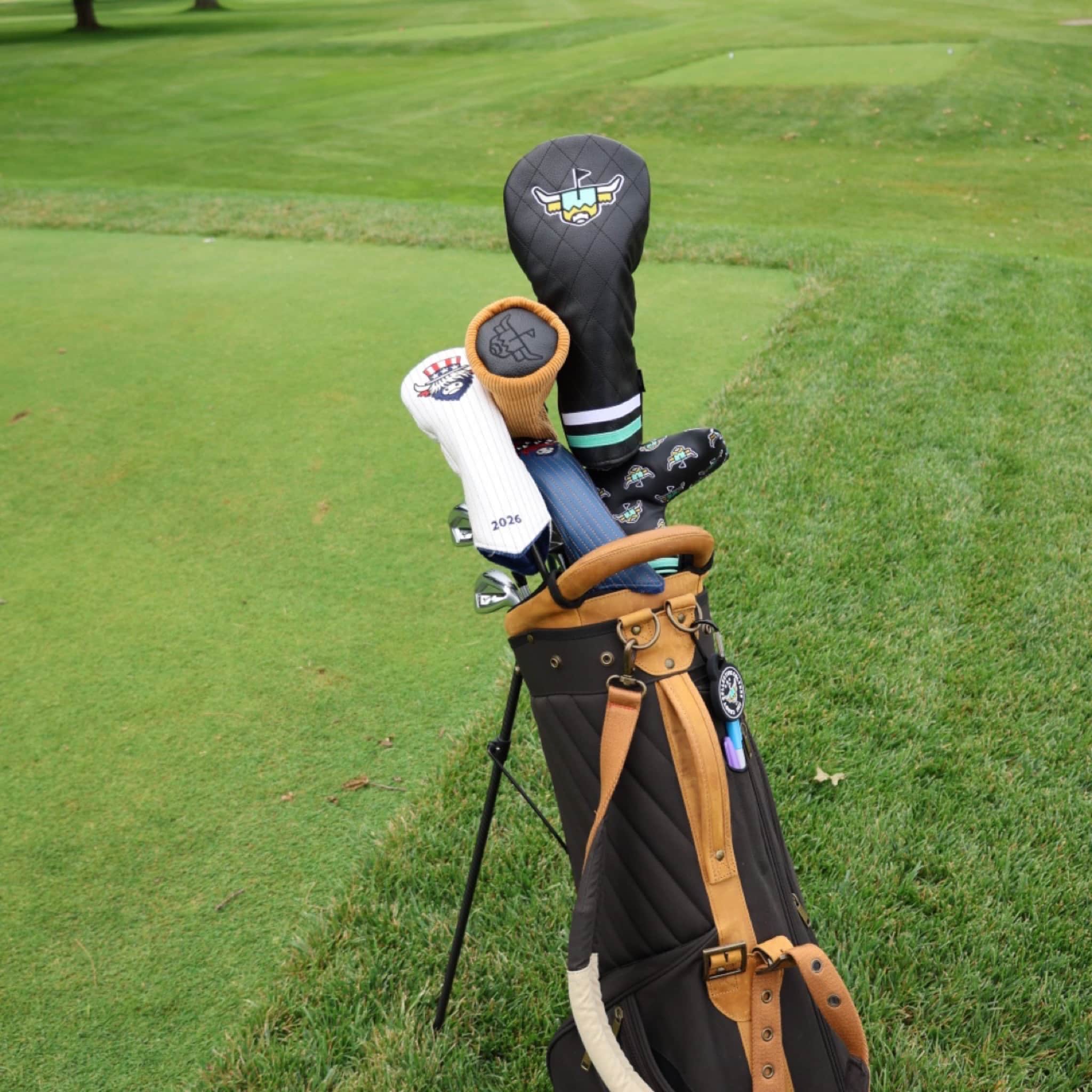 Corduroy Barrel Fairway Wood Headcover displayed in a premium golf bag on the course alongside other Caddy Collective Culture headcovers.