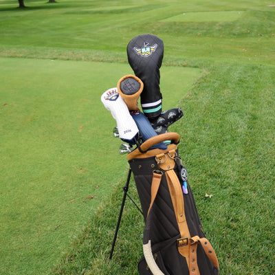 Corduroy Barrel Fairway Wood Headcover displayed in a premium golf bag on the course alongside other Caddy Collective Culture headcovers.