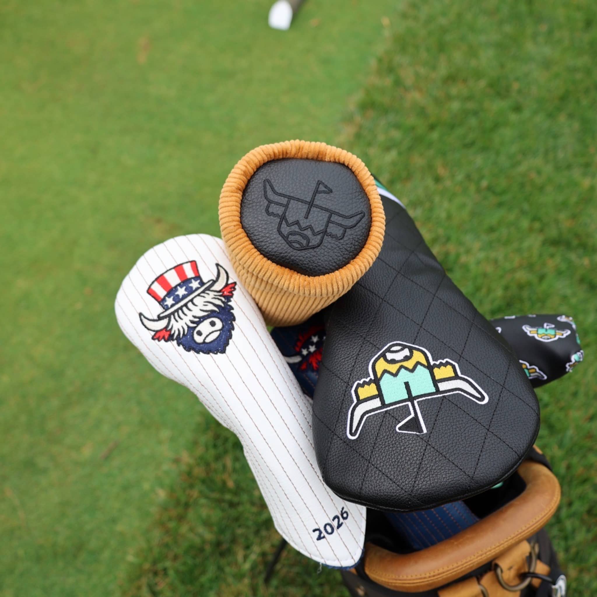 Corduroy Barrel Fairway Wood Headcover by Caddy Collective Culture displayed in a golf bag alongside premium golf headcovers on the course.