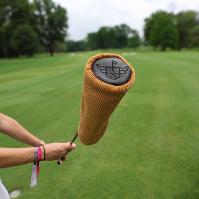 Corduroy Barrel Fairway Wood Headcover mounted on a golf club with golf course fairway blurred in the background.