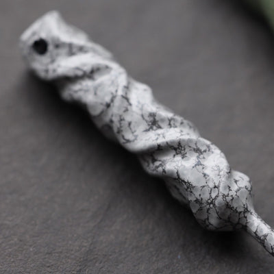 Close-up of Dual-Twist single prong divot tool in Palleon White finish showing twisted hand-forged texture