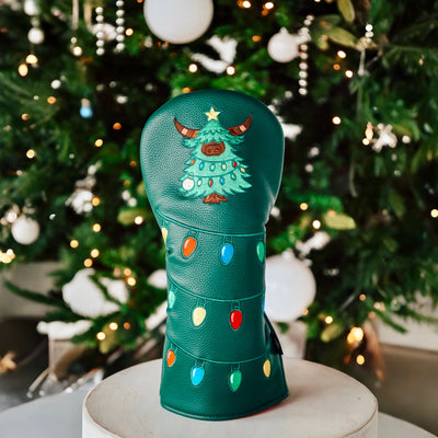  Full Evergreen Collection driver headcover standing upright in front of a Christmas tree, showcasing festive lights and Looper tree design.