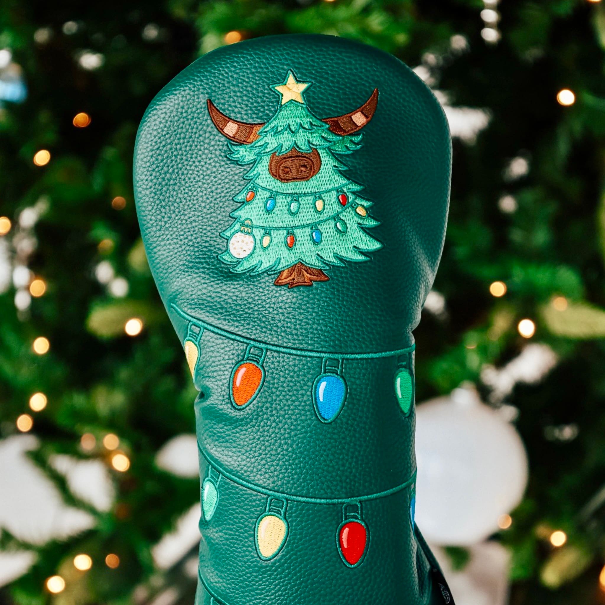 Drop driver headcover with Looper Christmas tree embroidery and colorful holiday lights, close-up view.
