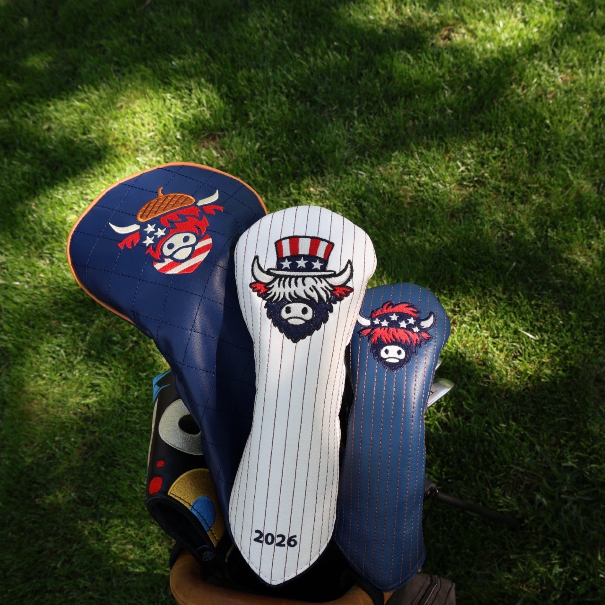 Americana-inspired golf headcovers from The Founders Collection by Caddy Collective Culture displayed on a golf bag