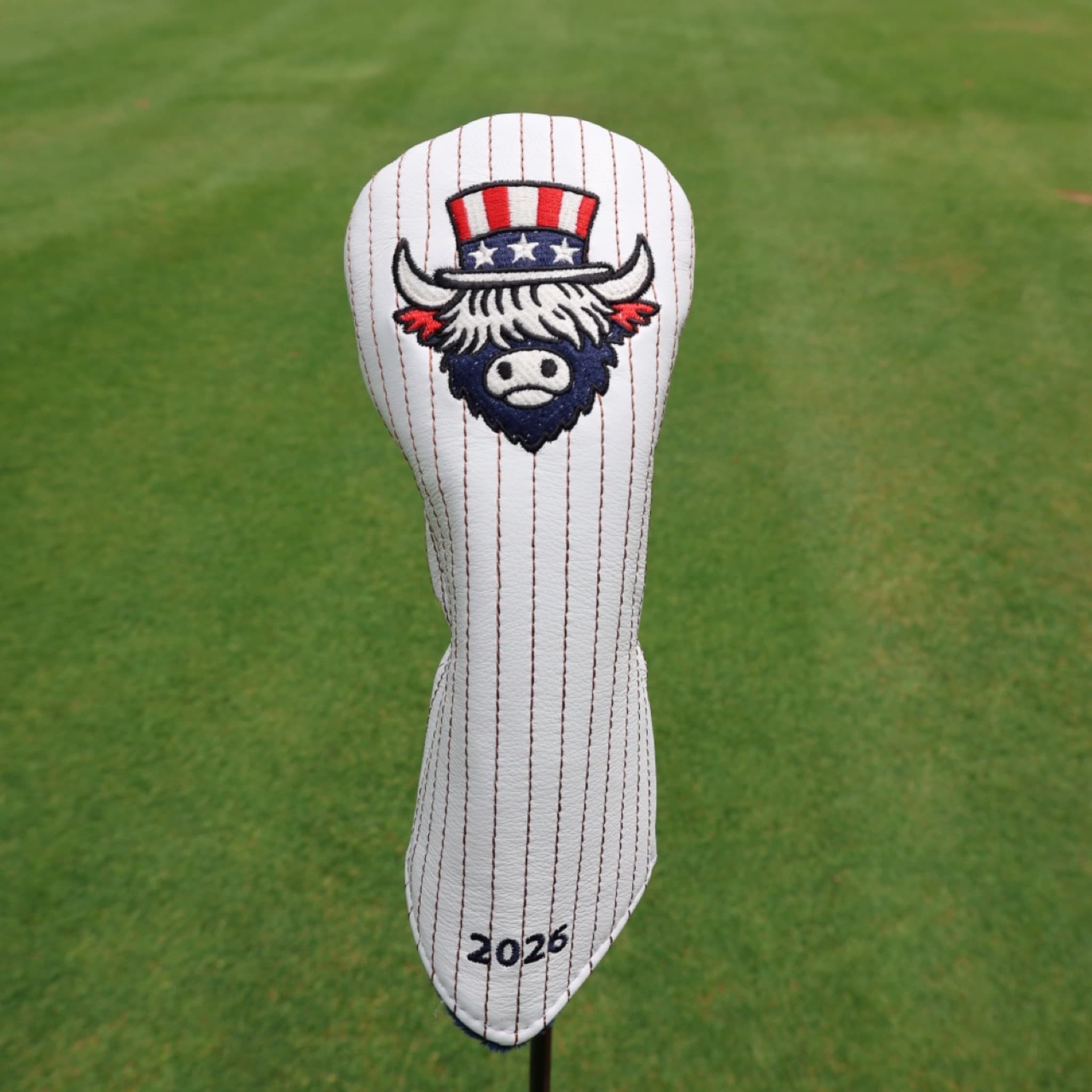 Founders Collection patriotic fairway wood headcover featuring the Liberty Looper design displayed on a golf course fairway.