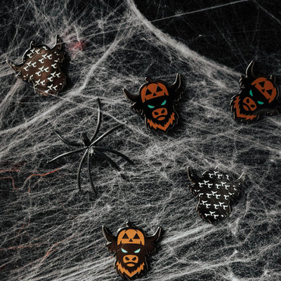 Looper After Dark pumpkin Looper ball markers arranged on dark web textured surface