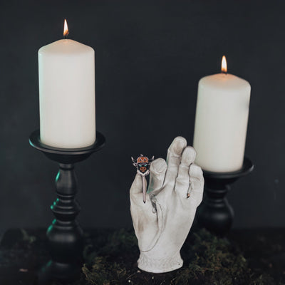 Looper After Dark combo tool displayed between two candles for Halloween-inspired luxury setup