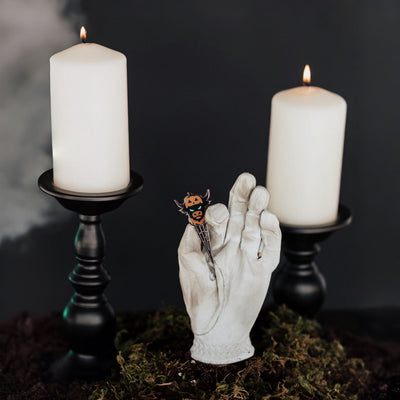 Looper After Dark Halloween divot tool collection displayed in moody candlelit setting