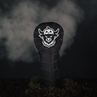 Looper After Dark driver headcover placed on moss in eerie Halloween scene